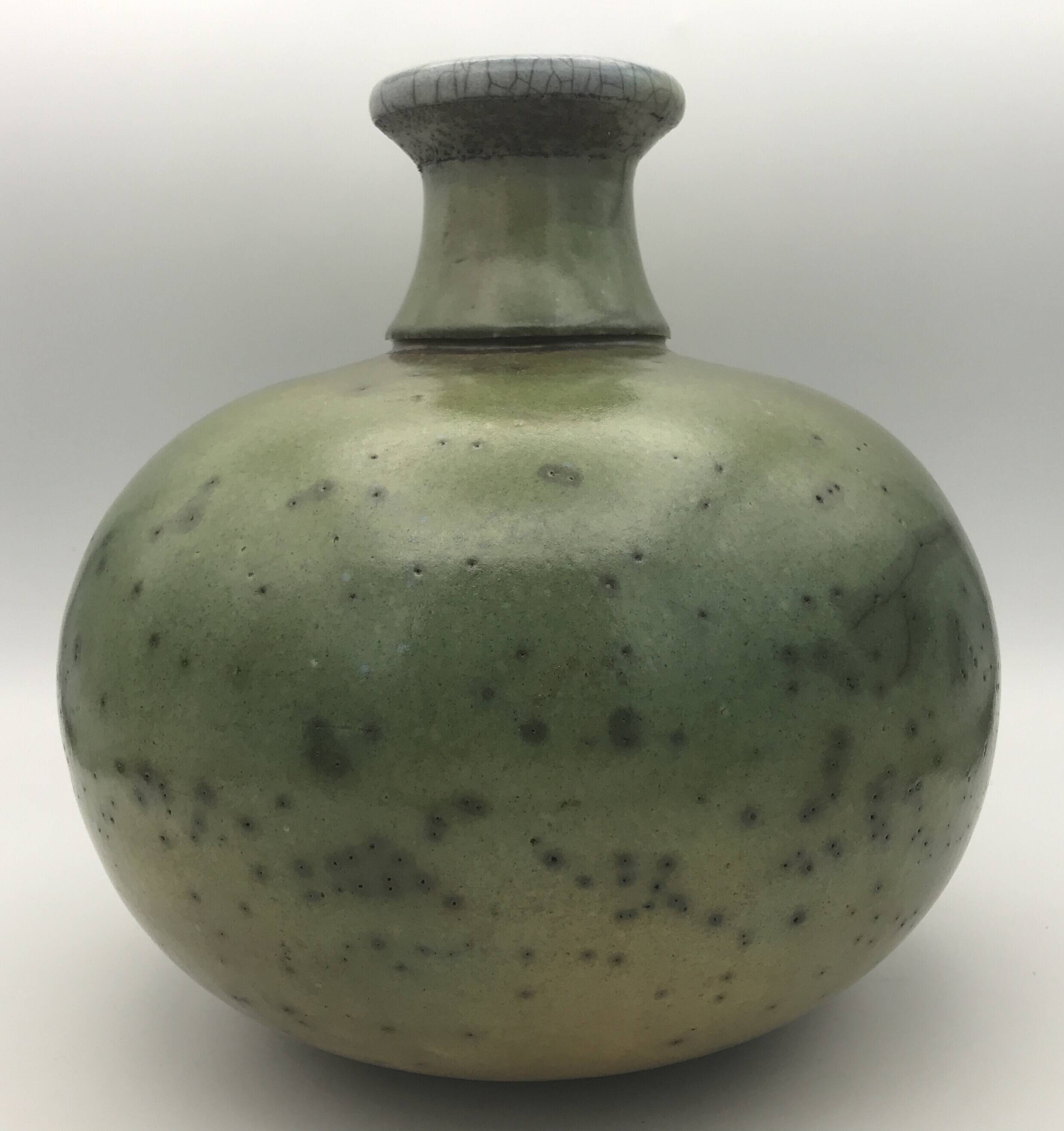 Contemporary vase ball shape raku shades of green and yellow