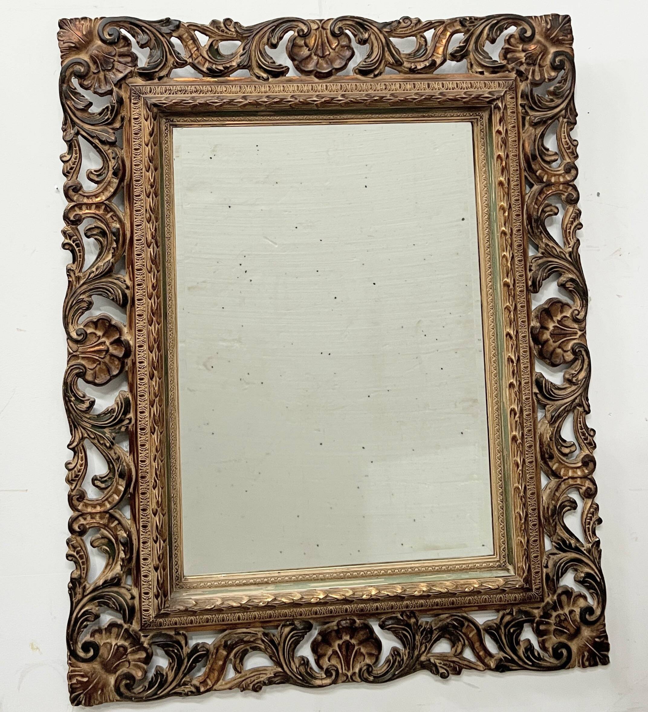 Napoleon III style mirror in carved wood, 20th century.
