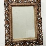 Napoleon III style mirror in carved wood, 20th century.