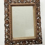 Napoleon III style mirror in carved wood, 20th century.