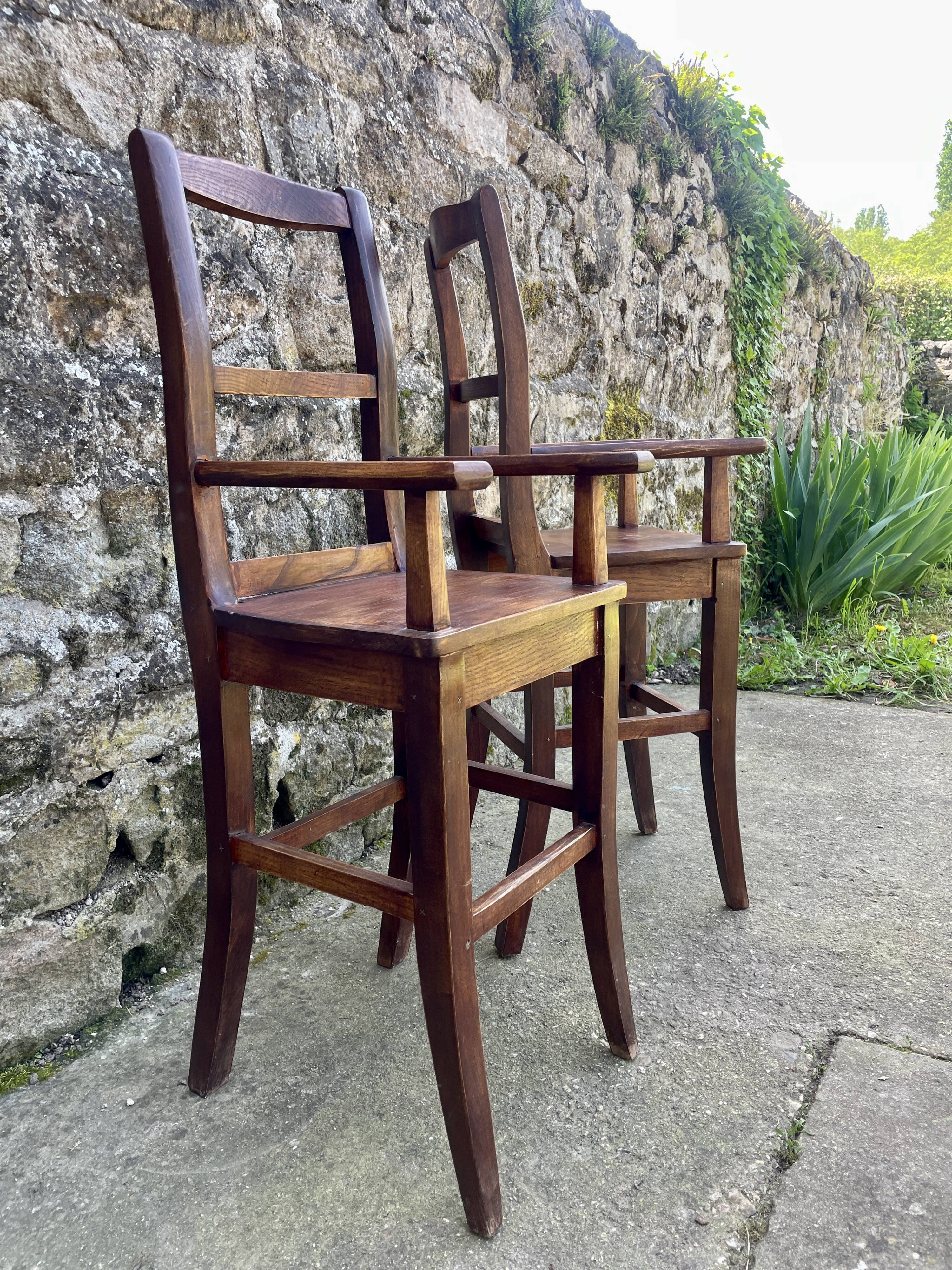 Pair of children's high chairs, early 20th century craftsmanship.