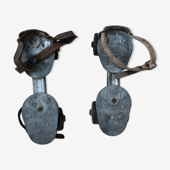 Old pair of roller skates metal grey + vintage leather straps
