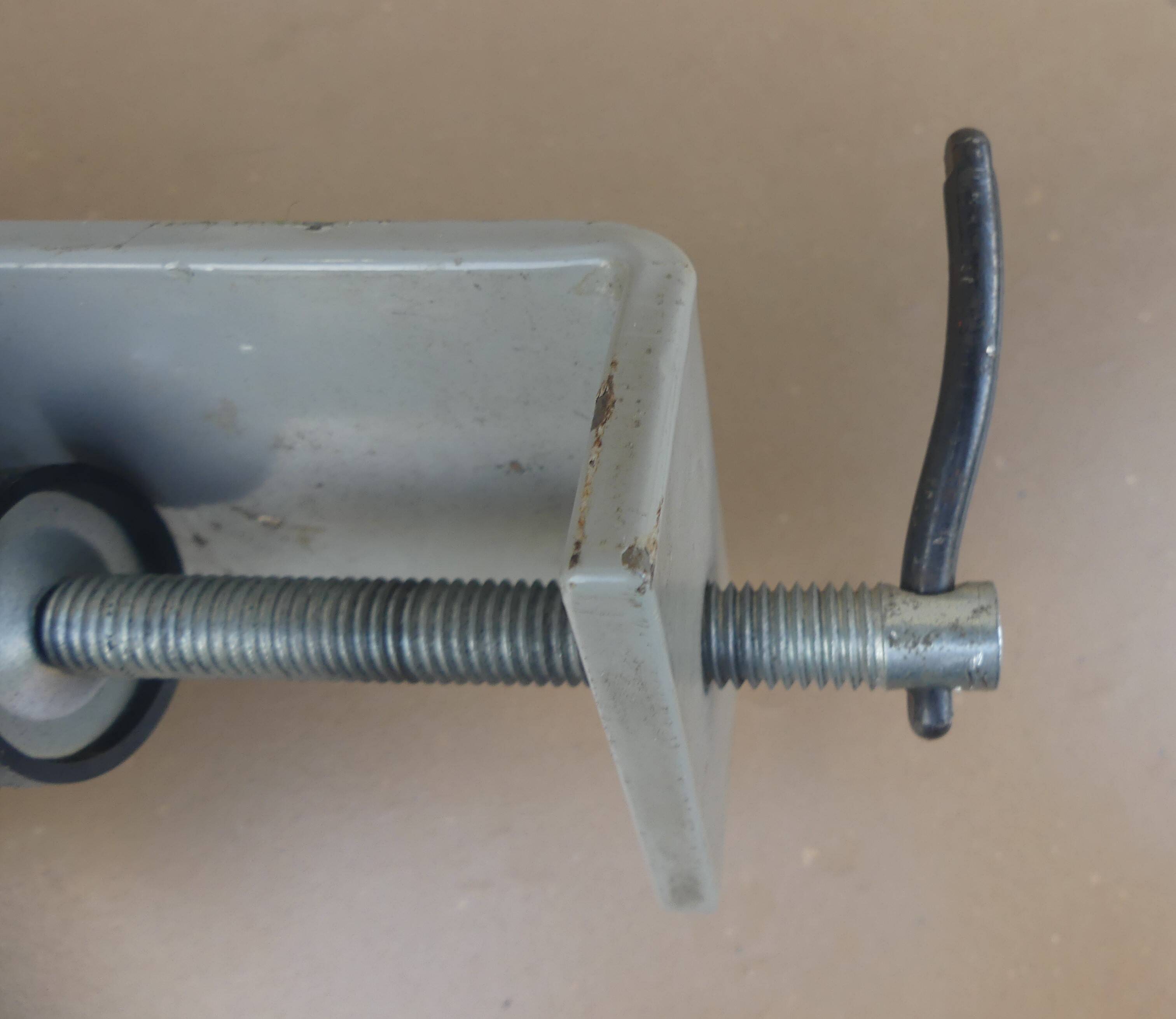 WALDMANN articulated workshop lamp with two industrial clamp arms for architects.