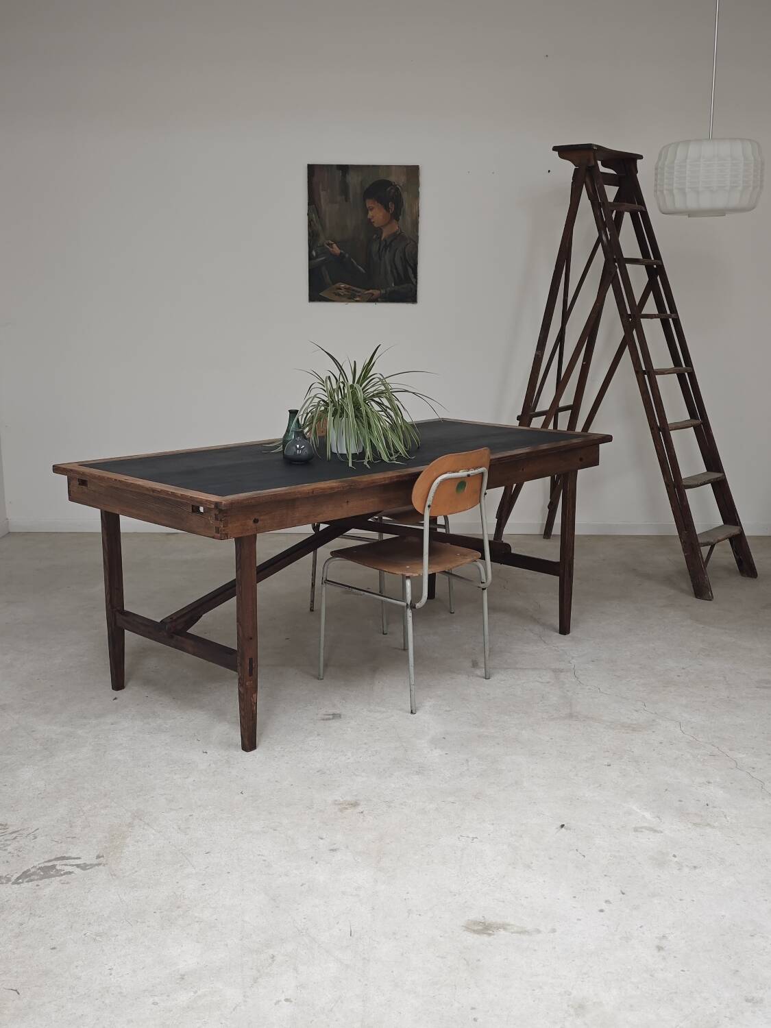 Vintage workshop folding table in oak with a hand-patinated black top.
