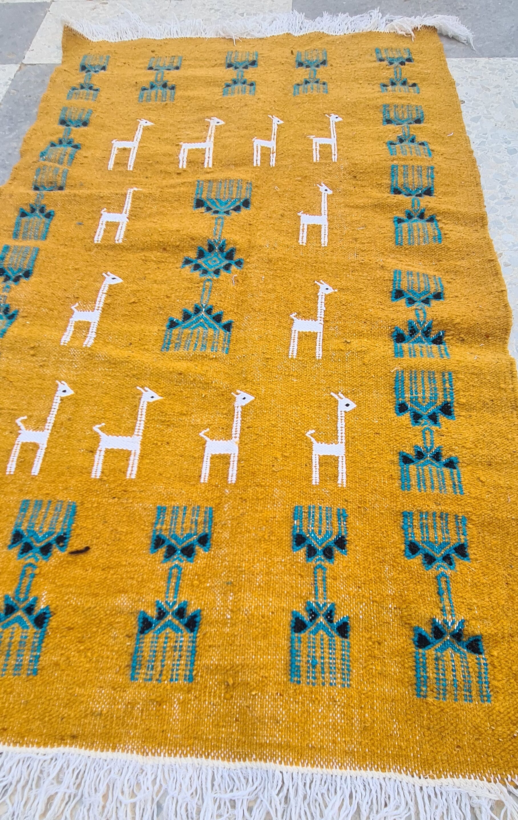 Traditional handmade gazelle-patterned carpet in pure wool