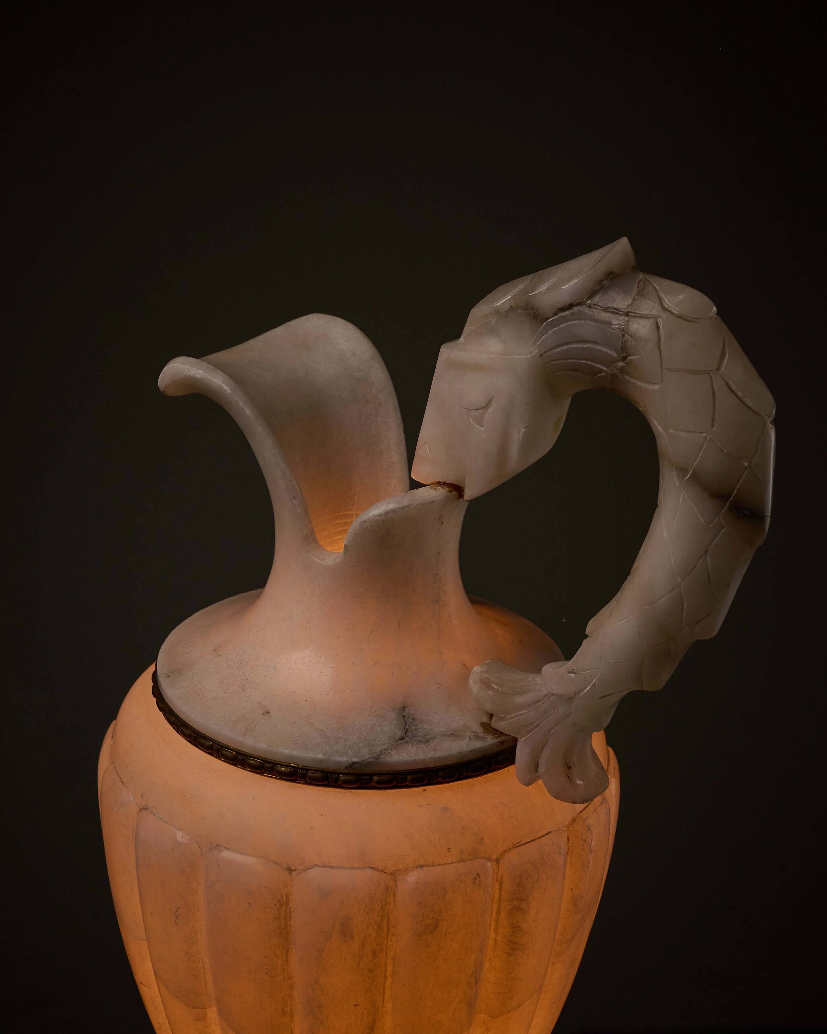 Carved alabaster urn lamp with stylized fish handle