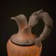 Carved alabaster urn lamp with stylized fish handle