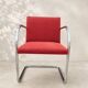 Vintage cantilever chair in chrome and burgundy fabric.