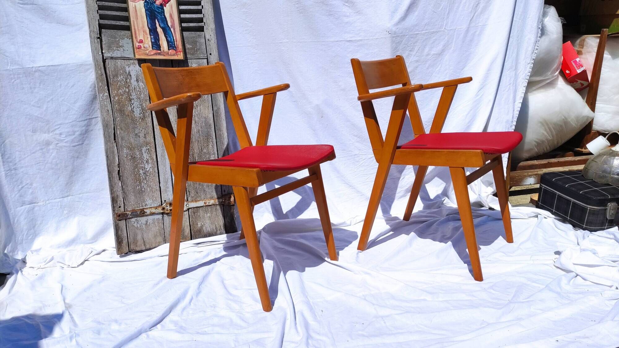 Pair of wooden armchairs and skaï foot compass of the 50s