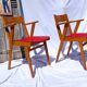 Pair of wooden armchairs and skaï foot compass of the 50s