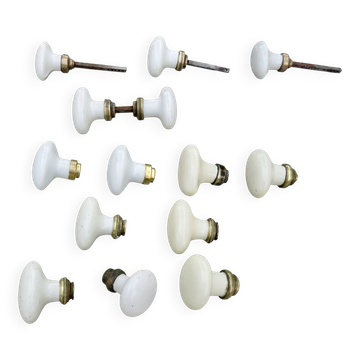 14 porcelain and bronze door handles, late 19th to early 20th century.