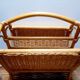 Antique rattan magazine rack