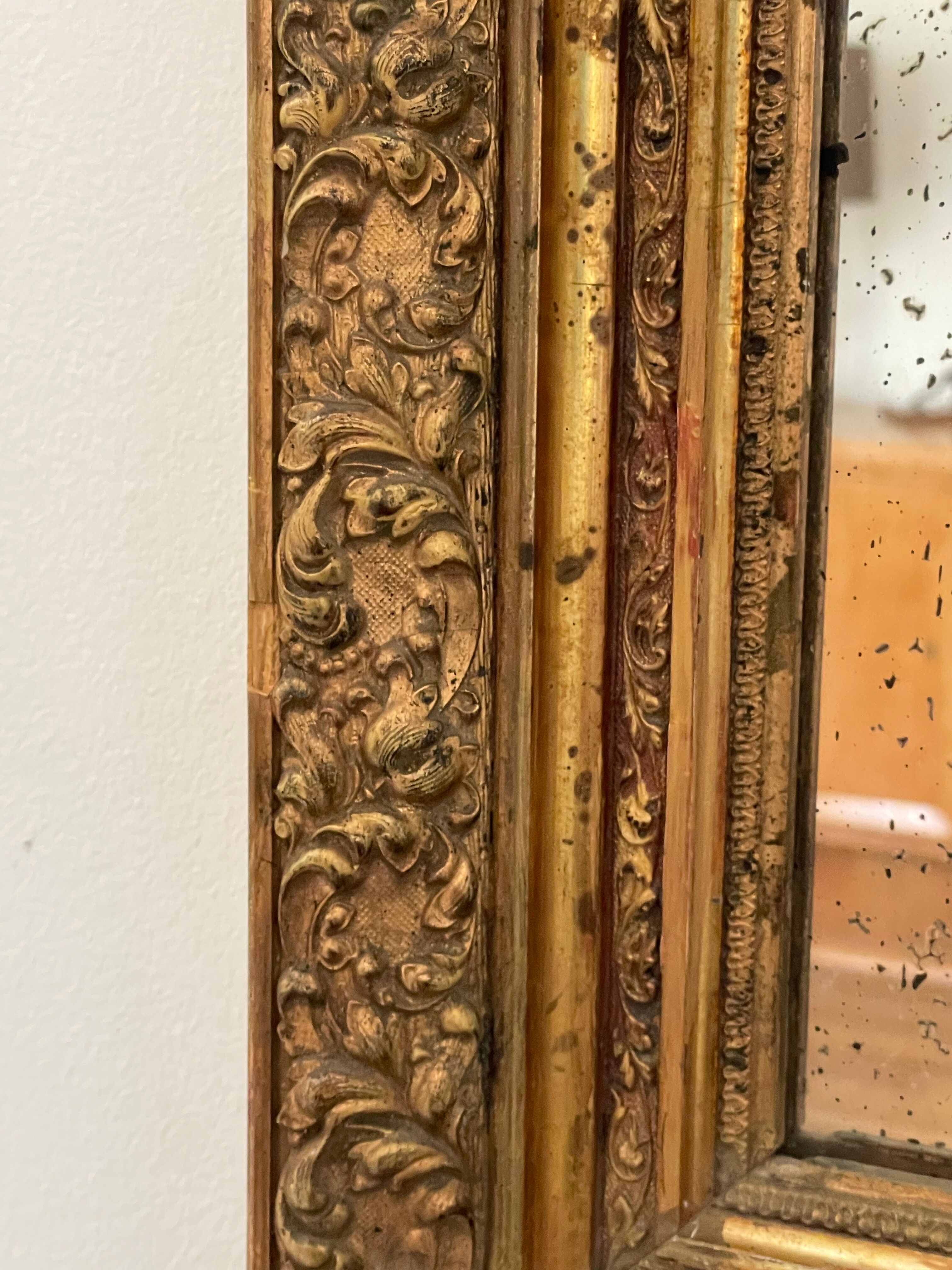 Antique mirror in gilded wood