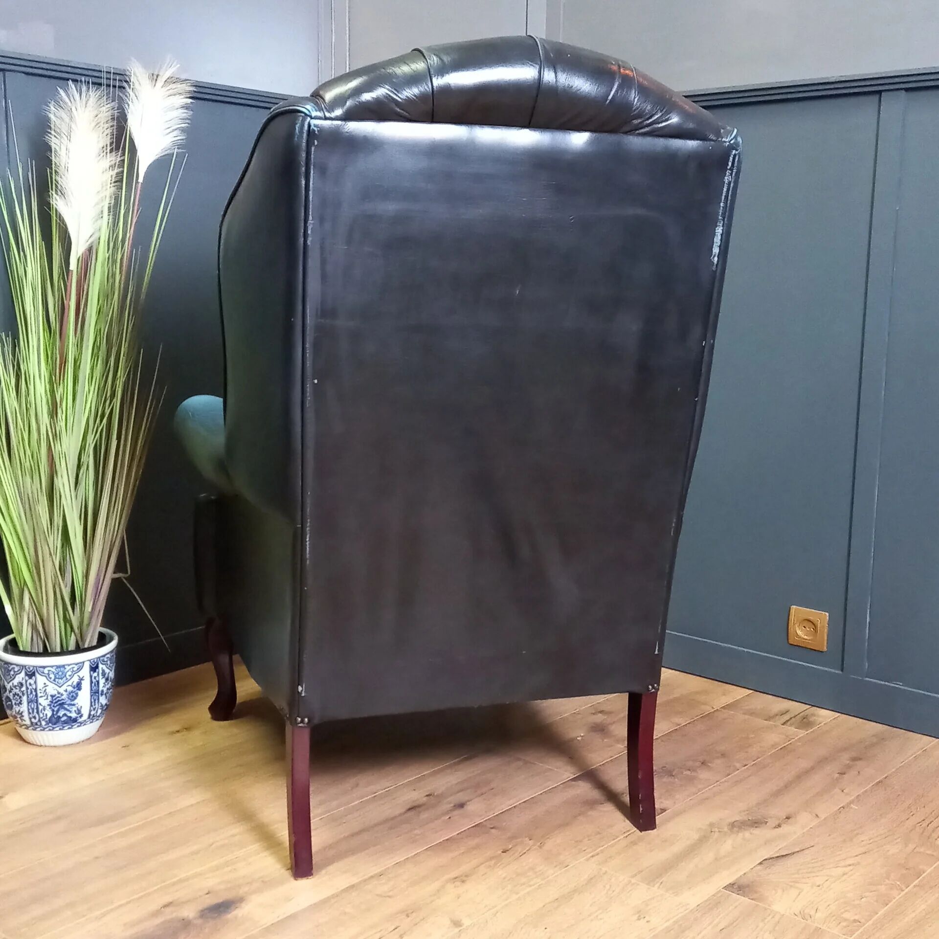 Blue chesterfield barrel back armchair