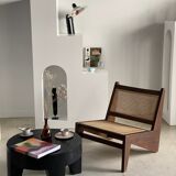 Reclined armchair in canned teak in natural wood