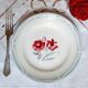 Old mismatched earthenware dinner plates