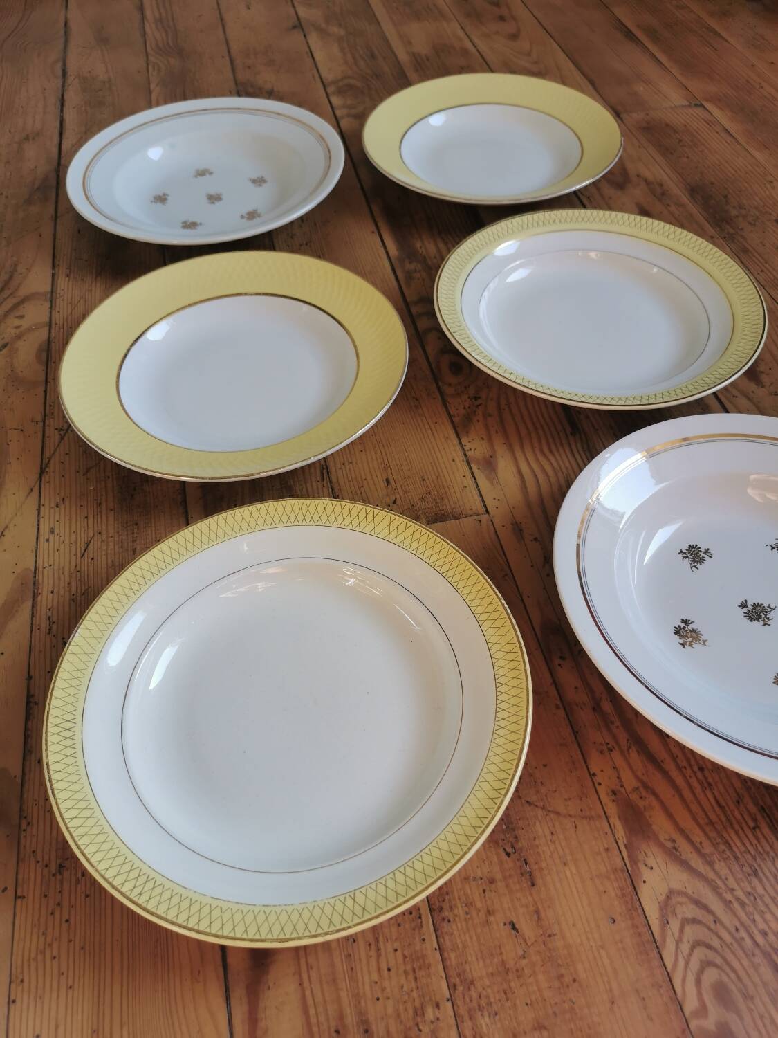 Vintage mismatched yellow and gold soup plates