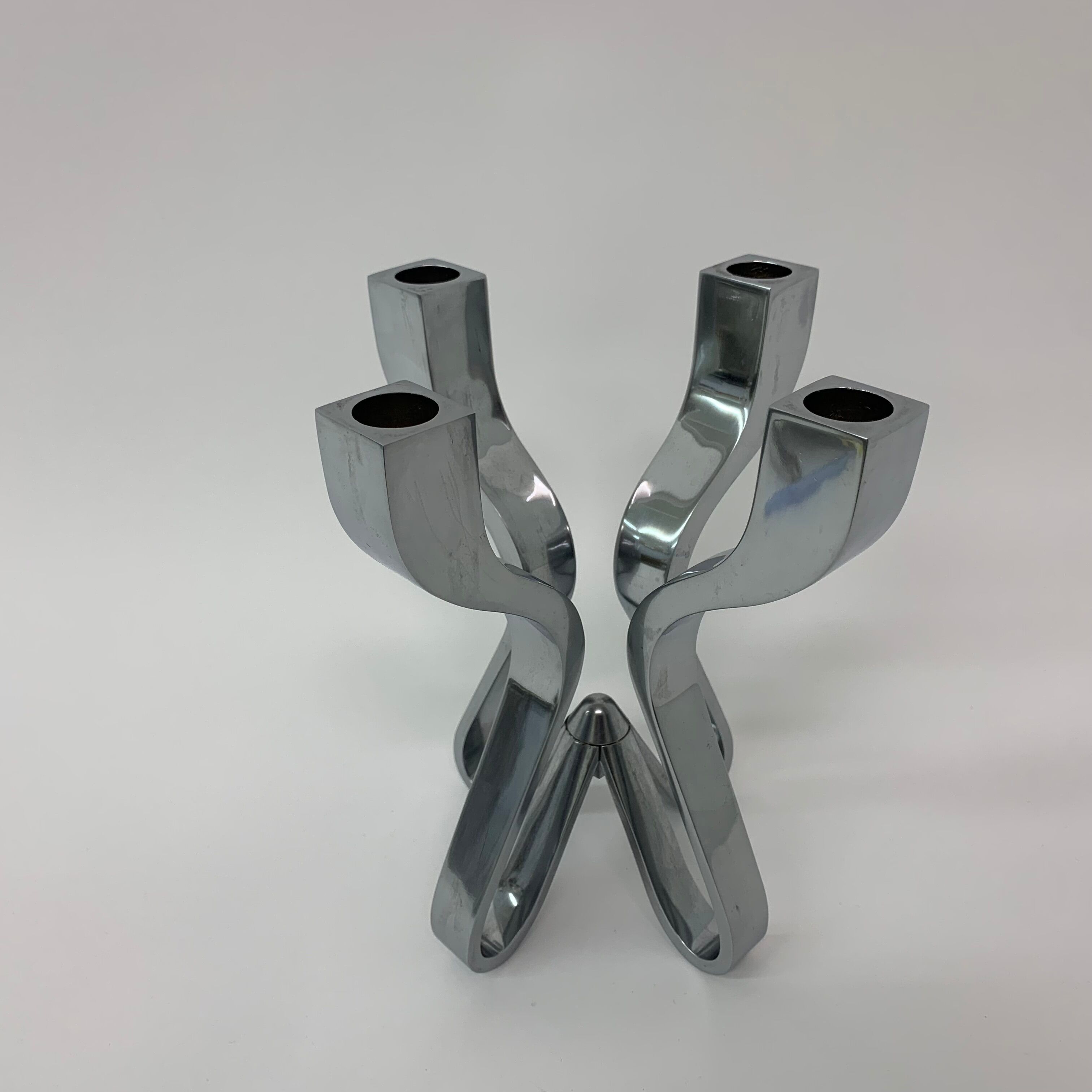 A chromed metal candle-holder "Chorus", design Karim Rashid, executed by Umbra / USA 2002