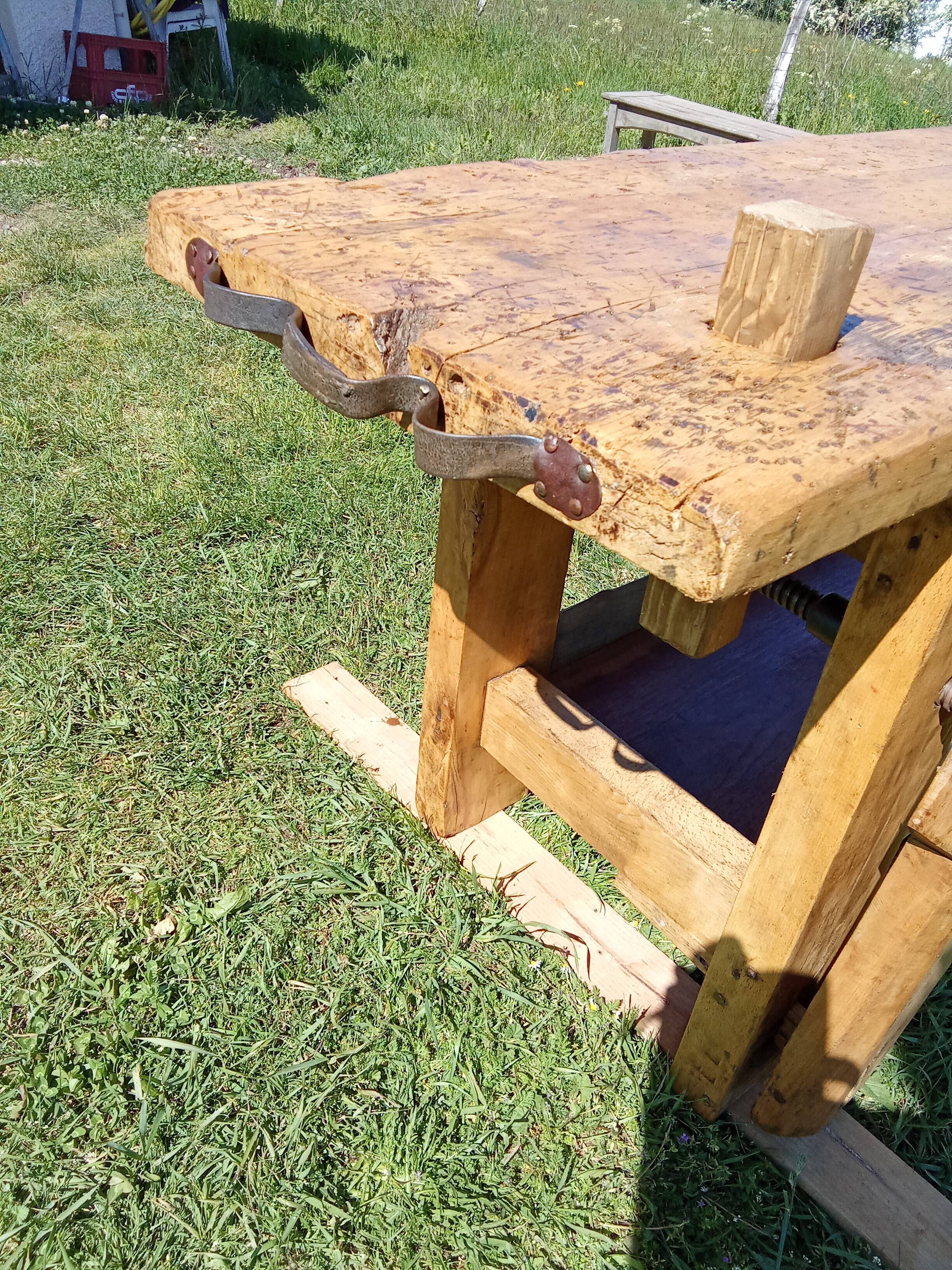 Old solid wood carpenter's bench with 2 functional vices.