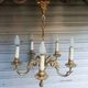 Antique gilded bronze chandelier in Louis XVI style, 5 lights, in working condition.