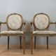 Paire de fauteuils louis XVI a dossiers médaillons