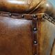 Antique armchair in patinated sheepskin