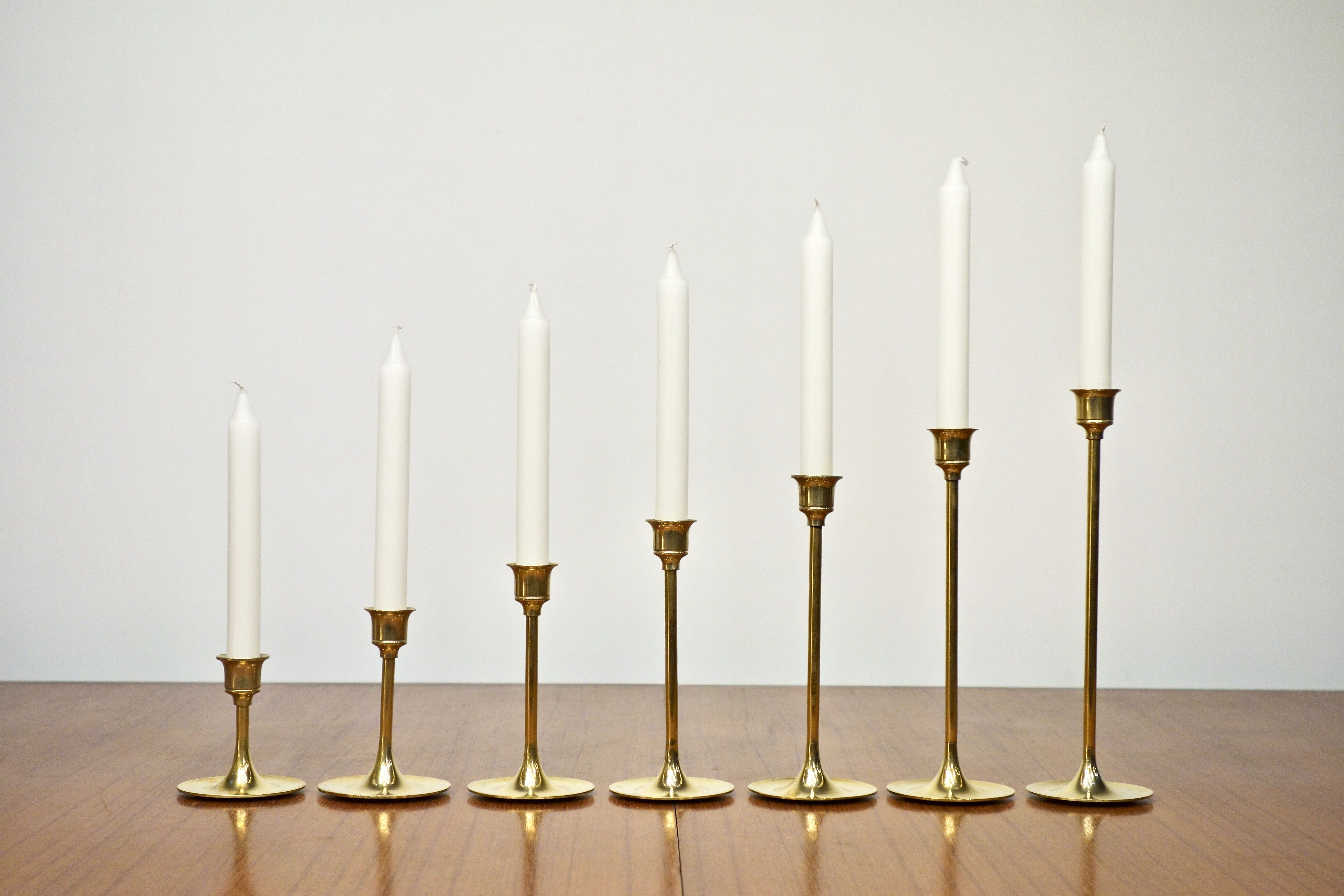 Set of 7 Scandinavian brass candle holders, 1960's