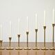 Set of 7 Scandinavian brass candle holders, 1960's