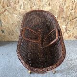 Old woven wicker baby cradle