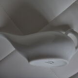 Old white porcelain pourer