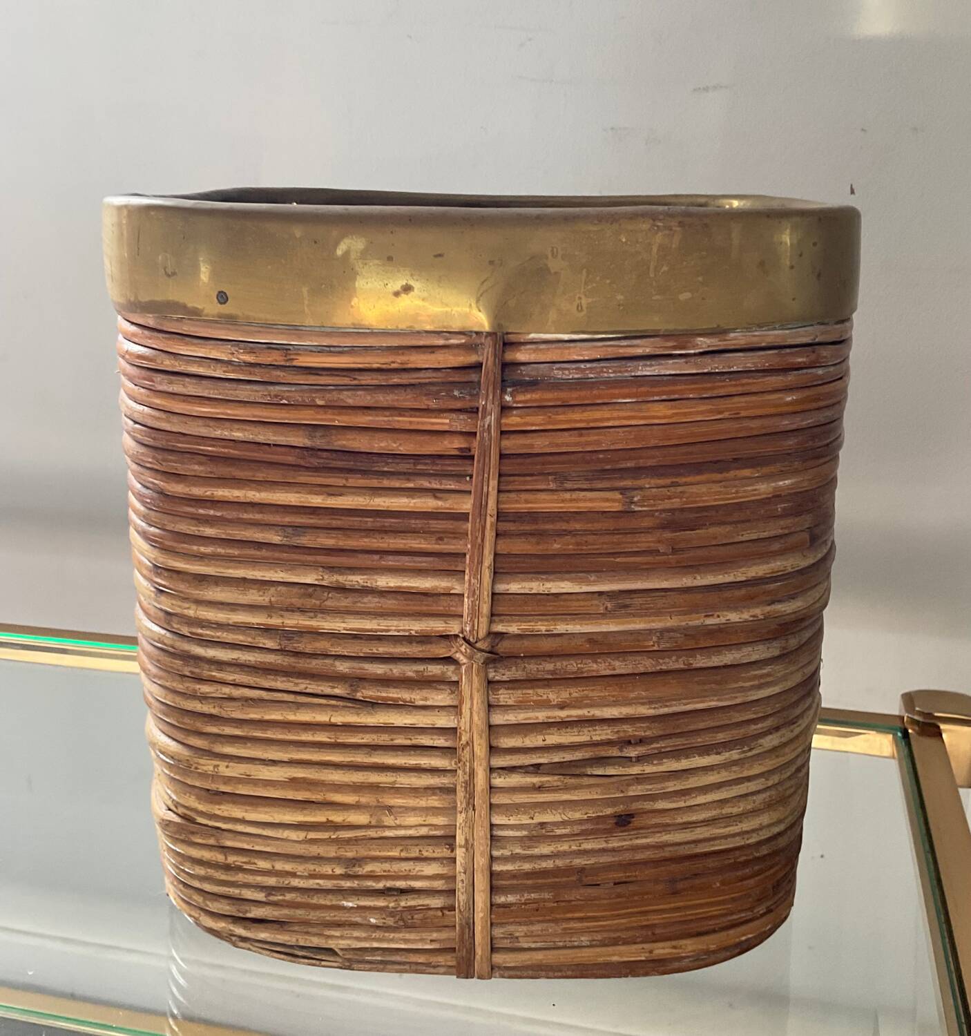 Rattan plant pot rimmed with brass from the 60s and 70s