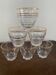 6 small golden glasses
