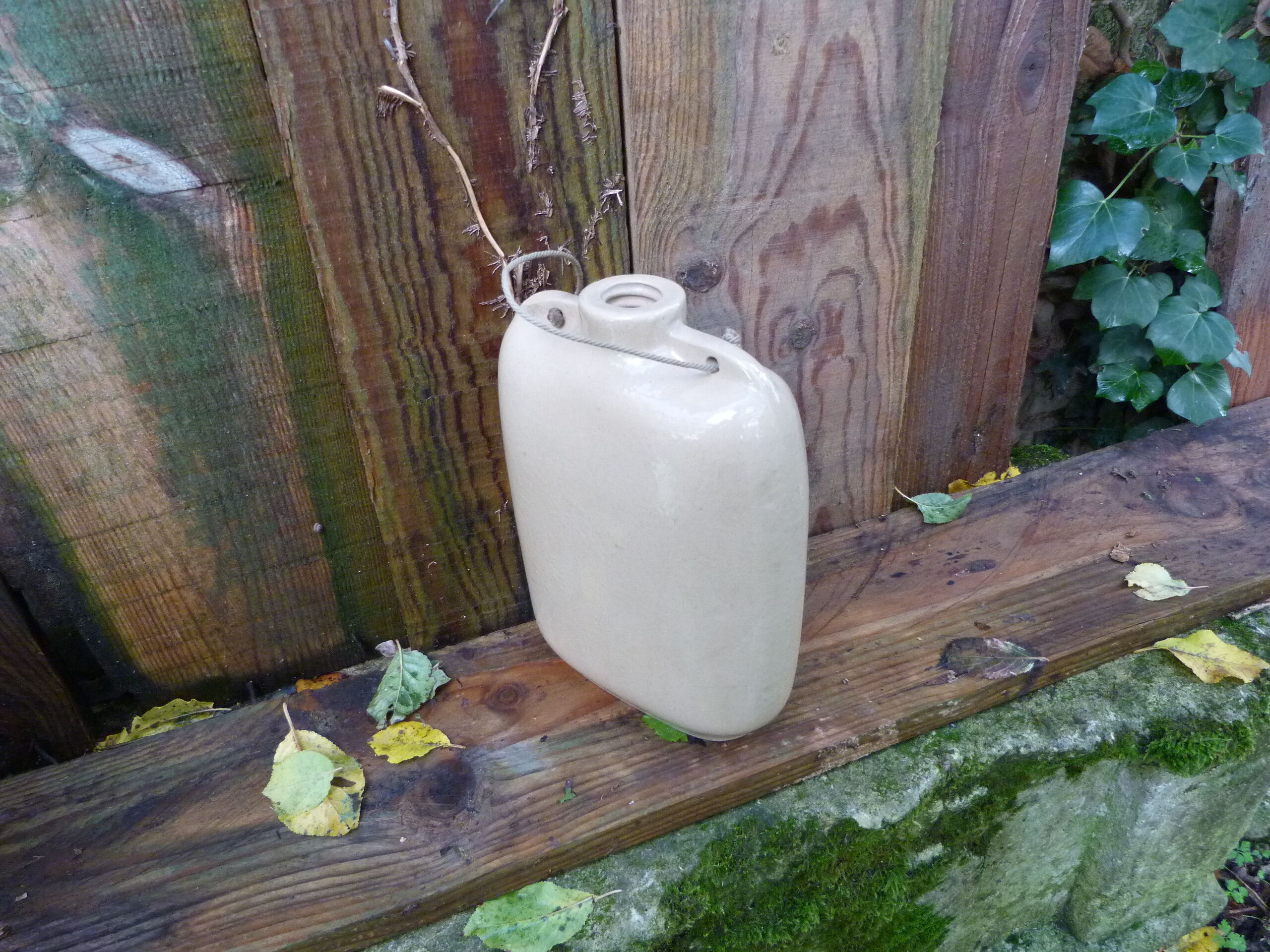English sandstone hot water bottle dated 1942
