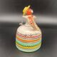 Trio of ceramic bell figurines