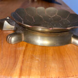 Empty brass turtle pocket