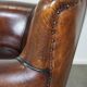 Stylish sheepskin leather armchair with a refined appearance