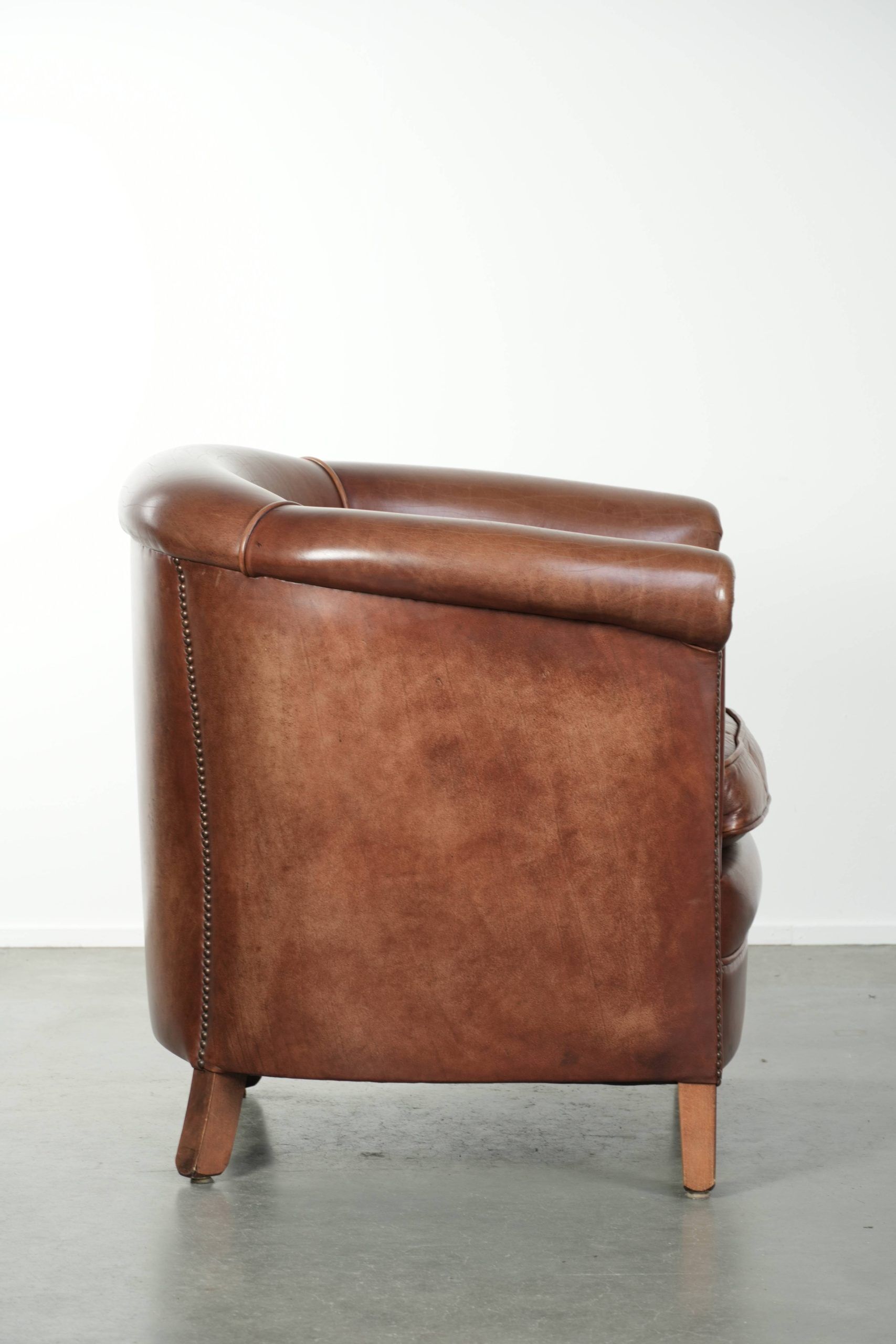 Cow leather club armchair in beautiful dark cognac colour in English style