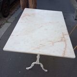 White bistro table in marble and cast iron