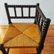 Antique corner chair made of turned wood.