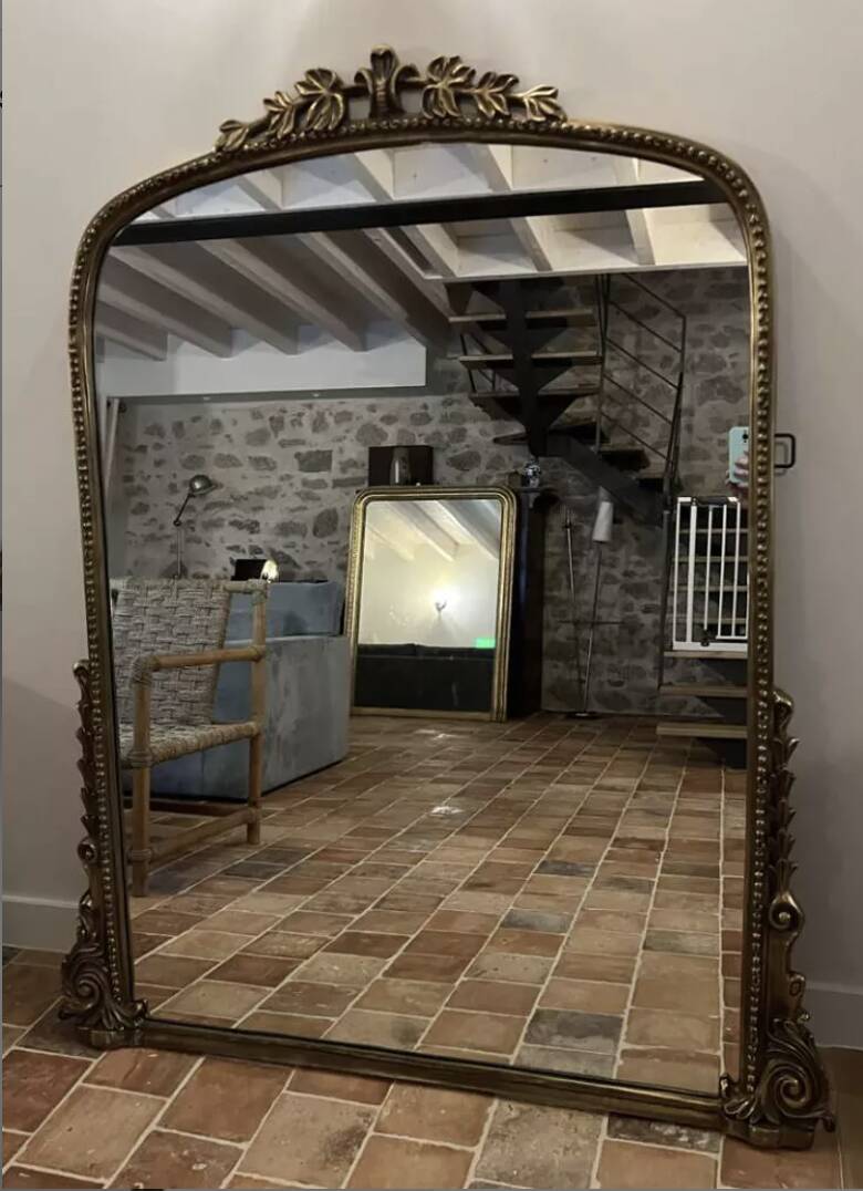 Large gilded mirror with pediment