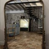 Large gilded mirror with pediment