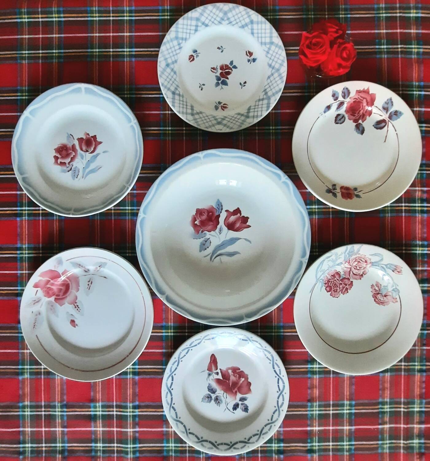 Mismatched antique flat plates in earthenware accompanied by a deep dish.