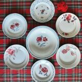 Old mismatched earthenware dinner plates accompanied by a deep dish