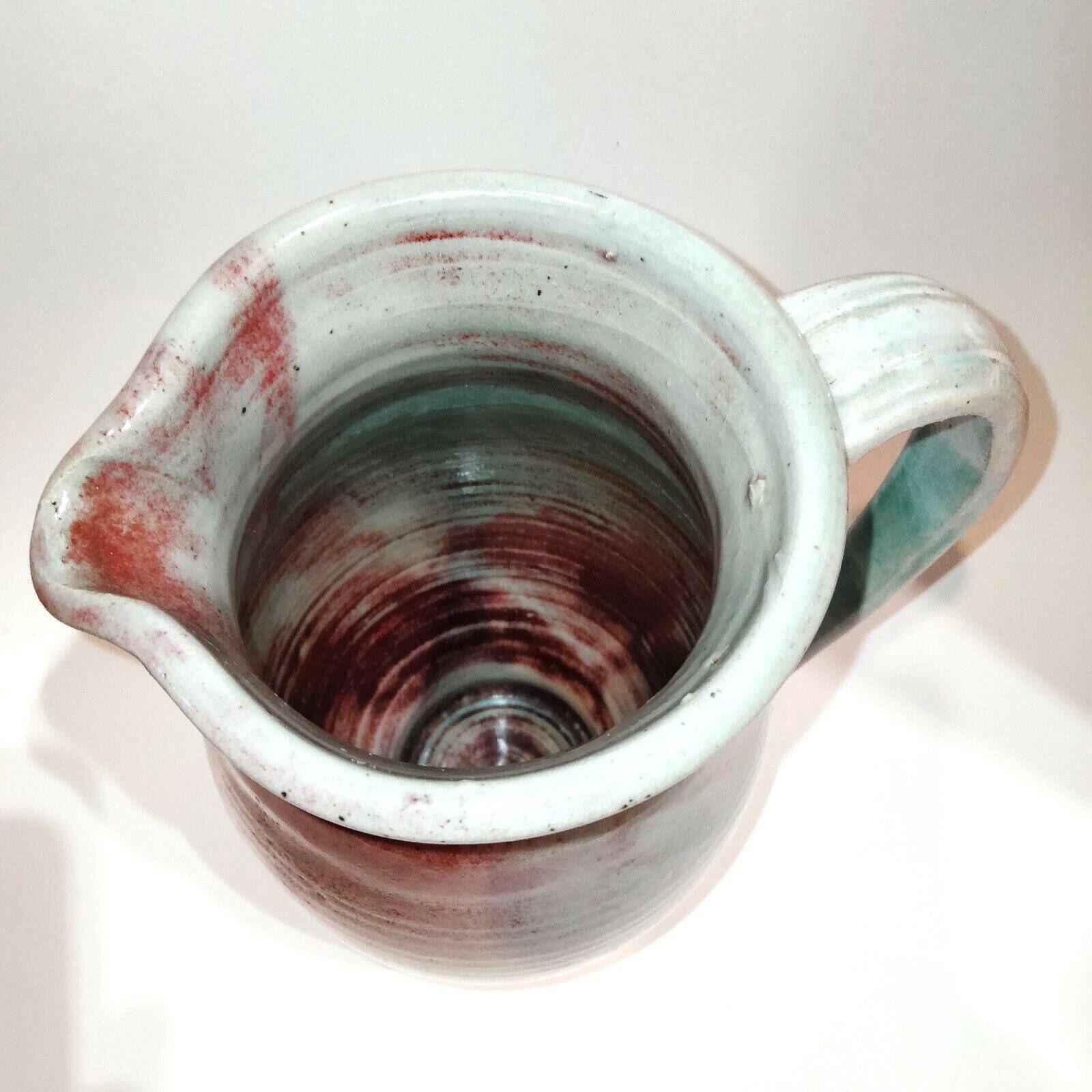 Red and grey glazed stoneware pitcher Signed Height 21 cm