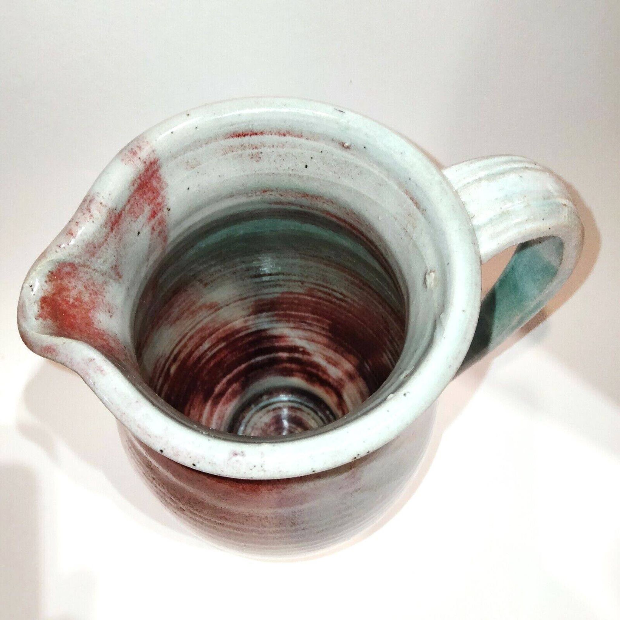 Red and grey glazed stoneware pitcher Signed Height 21 cm
