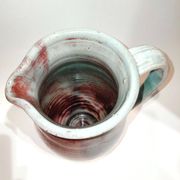 Red and grey glazed stoneware pitcher Signed Height 21 cm