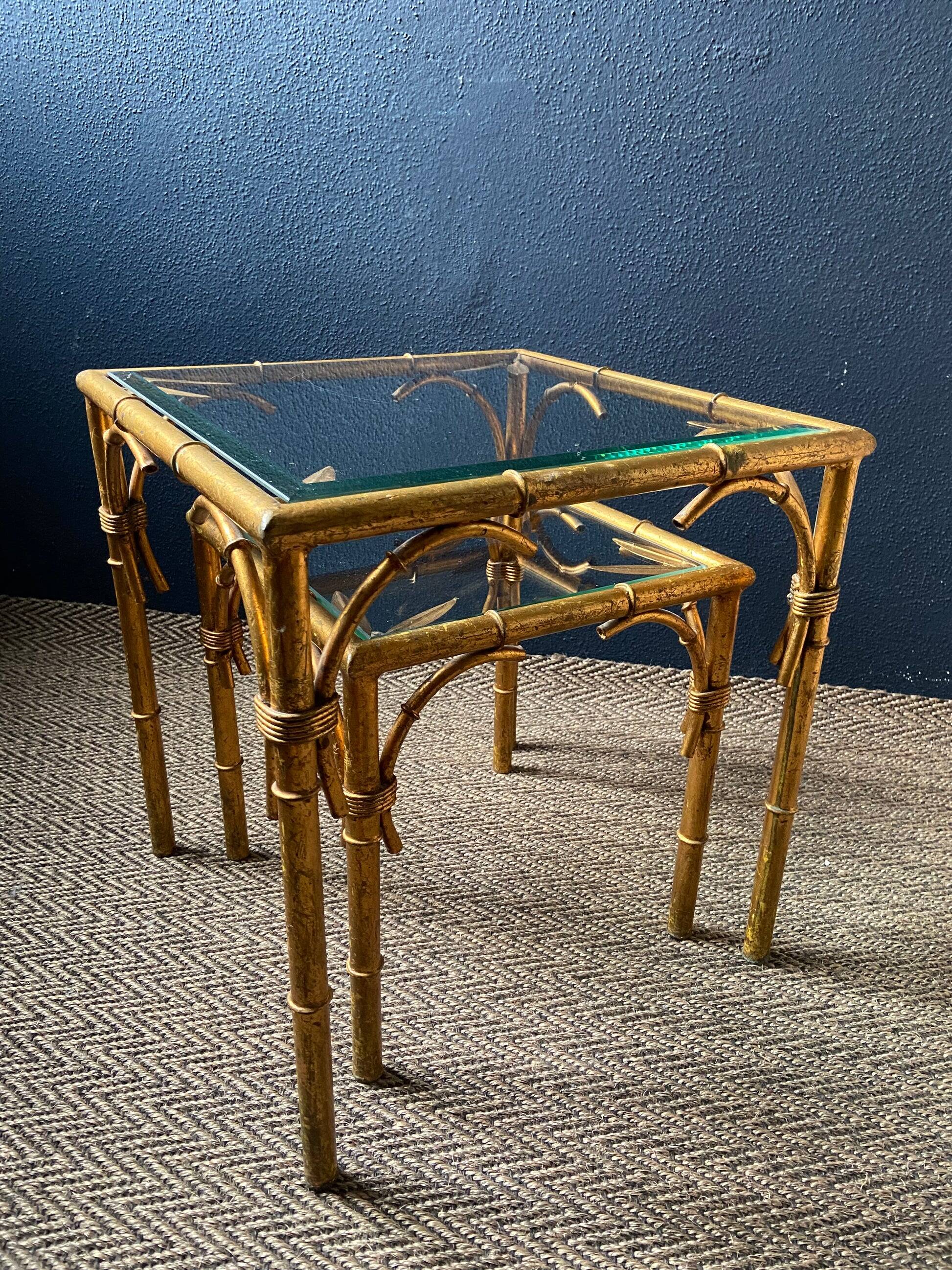 Pair of nesting tables in faux bamboo with glass tops, France, 1960s.