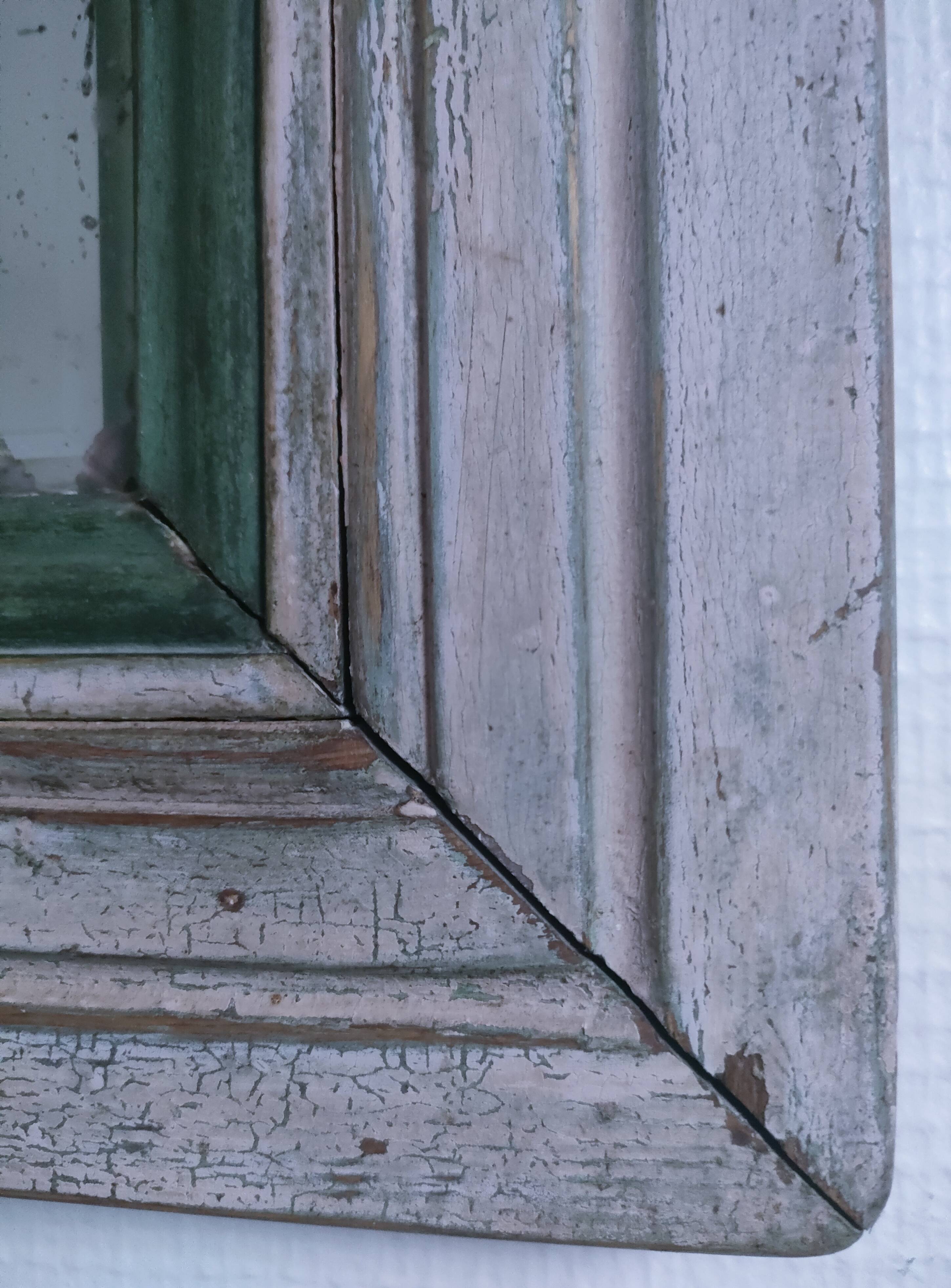 Beveled mirror patinated wood early 20th century