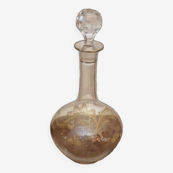 Old crystal decanter with gold decoration