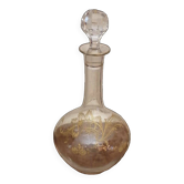 Old crystal decanter with gold decoration